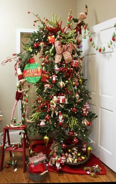 a christmas tree decorated with candy canes and bows