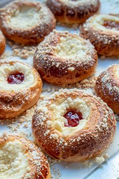 powdered sugar covered pastries on a white tray