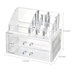 an image of a clear acrylic makeup box with compartments and dividers on the bottom