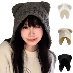 a girl with long black hair wearing a gray hat and three different colors of ears