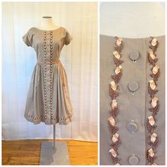 Pretty vintage dress from the 50s or early 60s. By Helen Whiting Inc. The fabric is a cotton or cotton blend. Sweet floral applique trim. Bust is 35 inches. Waist is 24 inches. Hips open to 52 inches. Length is 39 inches. Opens down the front with buttons and hook at waist. 2 belt loops, but no belt, it would be easy to snip off the loops. Great condition. Orange belt not included. Photographed with a half slip for fullness. Vintage Cotton Dress With Buttons, Cotton Vintage Dress With Buttons, 1950s Cotton Buttoned Dresses, 1950s Style Cotton Dress With Buttons, Cream Cotton Vintage Dress For Garden Party, 1950s Style Lined Cotton Vintage Dress, Fitted Beige Cotton Vintage Dress, 1950s Cotton Vintage Dress For Vintage Fashion Events, 1950s Cotton Vintage Dress