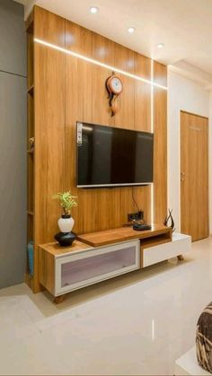 a living room with a flat screen tv on the wall