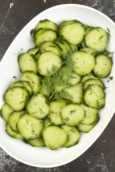 fresh dill cucumber salad in a white bowl with the title overlay