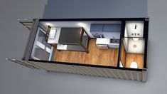 an overhead view of a tiny house with the kitchen and living room visible from above