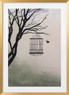 a bird in a cage hanging from a tree