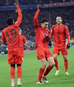 the soccer players are celebrating on the field