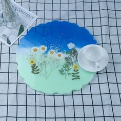 there is a plate with flowers painted on it