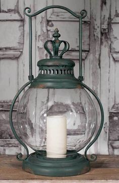 an old fashioned lantern with a candle inside