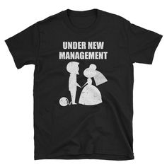 a black t - shirt with the words under new management on it and an image of a