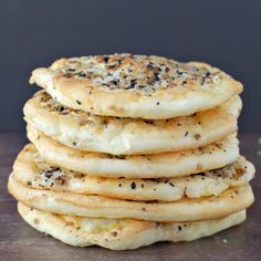 a stack of pancakes sitting on top of a wooden table