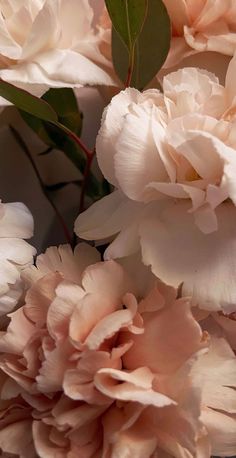 a bunch of flowers that are sitting on a table