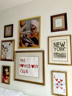 there are many framed pictures on the wall with words and photos above them that say new york, the homeboy club