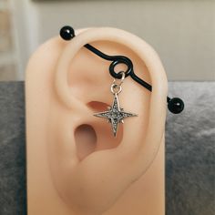 an ear with a silver star on it