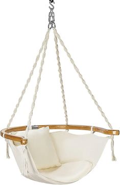 a white hanging chair with rope and pillows on the bottom, in front of a white background