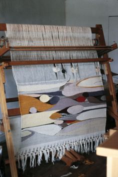 an old weaving loom is being worked on