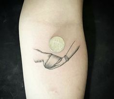 a small tattoo on the arm of a person with a knife in it's hand