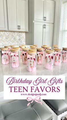 birthday girl gifts for ten favors in pink and silver jars on a kitchen countertop