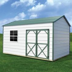 a small white shed sitting on top of a lush green field next to a blue sky