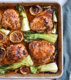 chicken, asparagus and oranges in a casserole dish