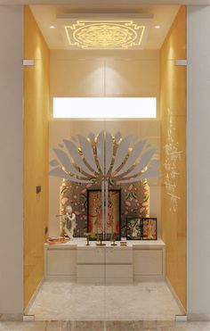 the entrance to an art gallery is decorated with gold and white accents, including artwork