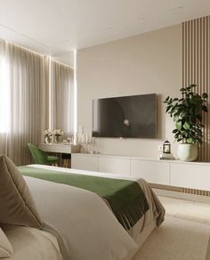 a bedroom with a large flat screen tv mounted to the side of it's wall