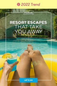 a person laying on top of an inflatable raft next to a swimming pool