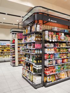 an aisle in a grocery store filled with lots of food