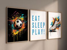 three posters on the wall with soccer balls and paint splatters, one saying eat sleep play