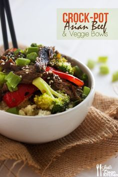 a white bowl filled with beef and veggies on top of a brown cloth