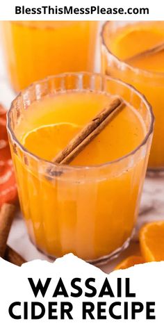 two glasses filled with orange juice and cinnamon sticks