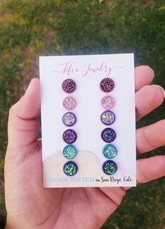 These Faux Druzy Earring Studs are absolutely gorgeous and made with high quality materials, just read our raving reviews from customers! They are lightweight, one-of-a-kind designed by me and Addy, unique, eye-catching, and beautiful. They shine and shimmer from every angle! The perfect birthday gift, or everyday wear! This is a 6 earring palette set. And comes with the following colors; -Berry rose gold - Rose Gold, Raspberry & gold colored druzy, set in a rose red earring post. -Light pink & light pink iridescent druzy set in a light pink earring post -Magenta -Magenta druzy with copper & slate blue notes, set in a red wine earring setting -Blue crystal -blue druzy with green & yellow notes, set in a blue earring setting -Lavender -purple lavender iridescent druzy, set in a light purple Nickel-free Multicolor Earrings For Birthday, Adjustable Hypoallergenic Earrings For Birthday, Multicolor Round Earrings For Birthday, Purple Hypoallergenic Jewelry For Birthday, Multicolor Jewelry With Matching Earrings For Birthday, Multicolor Hypoallergenic Jewelry For Birthday, Hypoallergenic Multicolor Jewelry For Birthday, Hypoallergenic Round Earrings For Birthday, Earring Stud Set