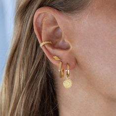 "Our handmade gold wave stud earrings! These beautiful and dainty wave-shaped earrings are perfect for those who love the beach and the ocean. The minimalist design makes them perfect for everyday wear, and the small size makes them great for second hole earrings or for those who prefer smaller earrings.  These wave stud earrings are a must-have for anyone who loves surfer jewelry or beach accessories. These gold wave earrings make the perfect birthday or Mother's Day gift for any woman who loves surf culture and the ocean. These earrings are handcrafted with love and care, making them a unique and special gift for any occasion. Our wave stud earrings are made with 18k gold-plated brass, ensuring they are skin-friendly and long-lasting. The beautiful and intricate design of the waves is pe Summer Gift Yellow Gold Earrings, Yellow Gold Pierced Earrings For Beach, Yellow Gold Beach Earrings, Trendy Gold Hoop Earrings For Beach, Gold Plated Earrings As Summer Gift, Gold Plated Earrings For Summer Gift, Second Hole Earrings, Wave Earrings, Surfer Jewelry