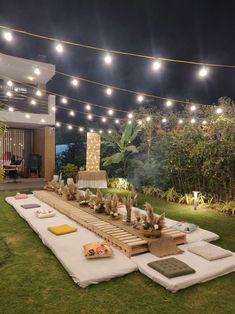 an outdoor party setup with lights and decorations