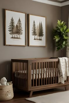 a baby's room with two pictures on the wall and a crib next to it