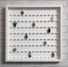 a white frame with lego figures on it