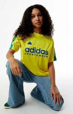 Stay sporty in the Yellow Tiro T-Shirt from adidas. This jersey-style tee features a classic crew neckline, short sleeves, and tonal stripes, complete with contrast 3-Stripes on the shoulders. The soft-touch rubberized adidas logo graphic adds a sleek finish, while the relaxed fit ensures comfort on and off the field.Tonal stripe jerseyShort sleevesCrew necklineadidas soft-touch rubberized graphic3-StripesRelaxed fit100% recycled polyester; Rib: 96% recycled polyester, 4% spandexMachine washableModel is wearing a size smallModel measurements: 5’10” height, 32” bust, 24” waist, 35” hipsLearn more about PacSun eco items adidas Womens Yellow Tiro T-Shirt size Small Graphic Tees Pacsun, Relaxed Fit Three Stripes T-shirt For Sports, Adidas Green Sportswear Top, Sporty Short Sleeve T-shirt With Side Stripes, Sporty Short Sleeve T-shirt For Sports Season, Casual Green T-shirt With Adidas Logo, Adidas Three Stripes T-shirt For Spring, Sporty T-shirt With Three Stripes For Sports, Casual Streetwear T-shirt With Side Stripes