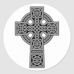 the celtic cross is shown in grey on a white round sticker with an intricate design