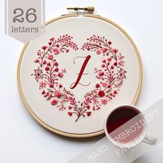 the embroidery kit is ready to be sewn and stitched into a heart - shaped frame