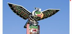 a totem pole with an eagle on it's head