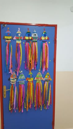 the door is decorated with colorful ribbons and hats on it's sides, along with other decorations