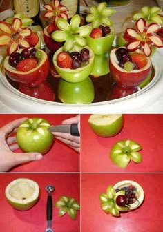 apples and grapes are arranged in flower vases on a platter for fruit carving