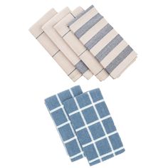 four blue and white napkins sitting on top of each other