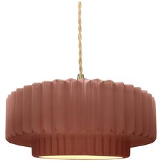 a pink pendant light hanging from a ceiling