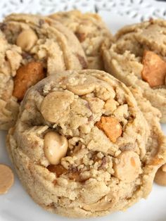 cookies with peanut butter and chocolate chips are on a white plate, ready to be eaten