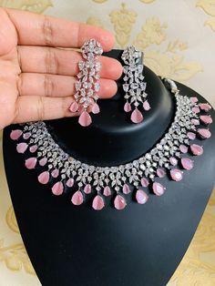 Pink Diamonds Necklace Statement Jewelry/ Statement Necklace/ Elegant Jewelry/ Unique Jewelry/ Indian Jewelry/ CZ Choker Necklace/Sabyasachi ITEM DESCRIPTION Metal        =  Silver Plated Occasion  = Wedding, Party Wear, Bridal Color        = White and Pink Size          = Necklace Length = 7 Inches Long, Earring Size = 2.5 Inches Long,  Free Shipping 100% Satisfaction Guarantee: 1 Year Warranty, Long Lasting Plating, High-Quality Stones Occasion: Perfect choice for any Indian occasion.  Care: I Pink Jewelry Set, Engagement Necklaces, American Diamond Necklaces, Jewelry Set Design, Bridal Choker, Diamonds Necklace, Bridal Fashion Jewelry, Indian Jewelry Sets, Pink Bridal