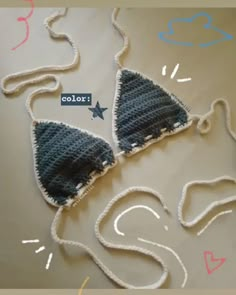 two crocheted bras are laying on the table with string attached to them