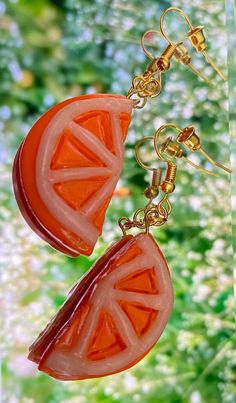 I kept up with the fruit theme and made these orange earrings! I think they are super cute! They are made out of oven-bake clay and gloss, attached to jump rings and a hook. Let me know if you have any questions! Hope you like them! Fun Orange Dangle Earrings, Fun Orange Drop Earrings, Fun Orange Earrings For A Gift, Orange Dangle Resin Earrings, Fun Orange Earrings As A Gift, Orange Resin Dangle Earrings, Fun Orange Earrings For Gifts, Fun Orange Earrings For Gift, Cute Nickel-free Orange Jewelry