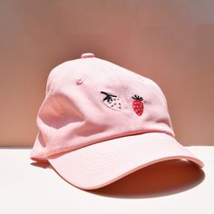 Look chic in our LARK Strawberry hat 🍓 Light pink with embroidered strawberries. Cute Hats With Embroidered Logo And Curved Brim, Cute Baseball Cap With Embroidered Logo And Curved Brim, Trendy Pink Brimmed Hat, Trendy Brimmed Hat With Embroidered Logo, Summer Baseball Cap With Embroidered Logo And Short Brim, Pink Cotton Dad Hat, Pink Embroidered Logo Baseball Cap, Trendy Pink Dad Hat With Embroidered Logo, Spring Baseball Cap With Embroidered Logo