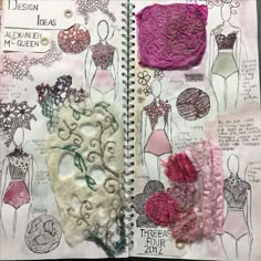 an open notebook with drawings and designs on the pages, including bras and dresses