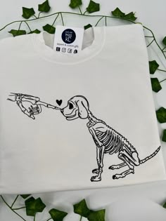 skeleton dog Skeleton And Dog Tattoo, Skeleton Dog Tattoo, Dog Skeleton Tattoo, Dog Shirt Design, Skeleton Dog, Ripped Tshirt, Dog Skeleton, Skeleton Tattoos, Cute Shirt Designs